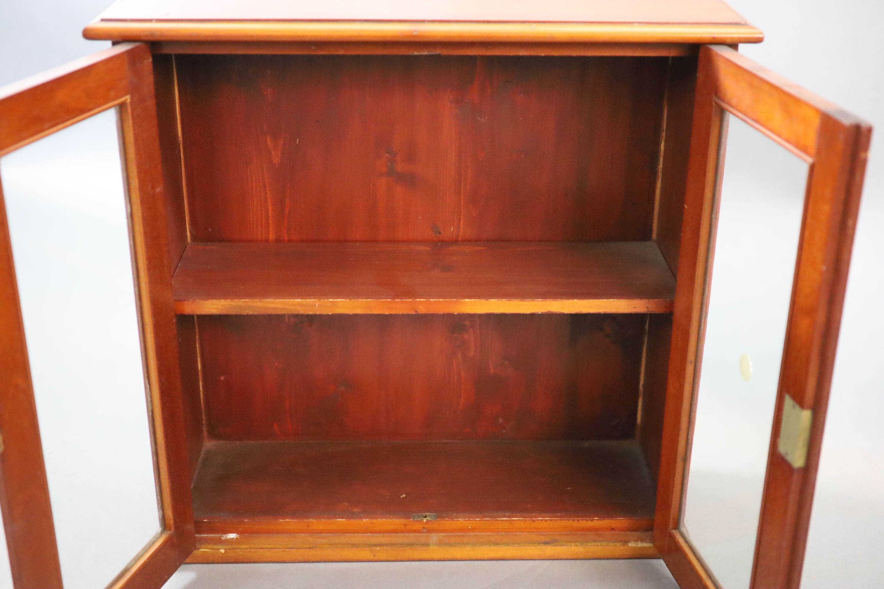 A small Edwardian mahogany wall cabinet, W.58cm D.21cm H.57cm